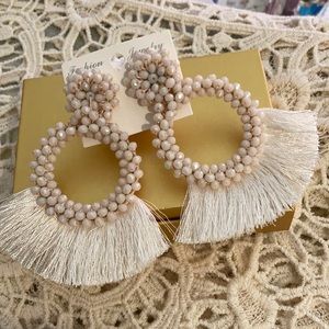 Ivory colored beaded fringe earrings.